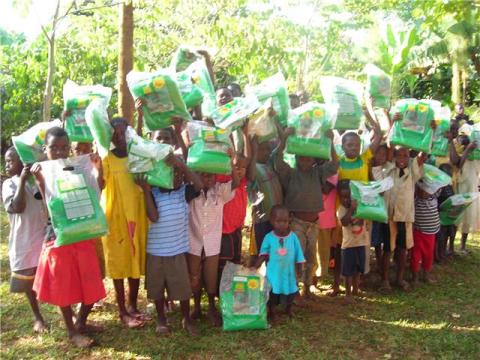 Kids with mosquito nets in Mawoito